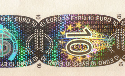 The hologram found on credit cards and other everyday objects are mass-produced by stamoing the pattern of the hologram on to the foil